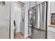 Stainless steel refrigerator next to a laundry area in a bright kitchen at 3420 Wild Oak Bay Blvd # 120, Bradenton, FL 34210