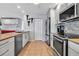Contemporary kitchen featuring stainless steel appliances, a breakfast bar, and a convenient layout at 3420 Wild Oak Bay Blvd # 120, Bradenton, FL 34210