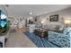 Bright and airy living room featuring tile floors, comfortable seating, and an open layout with seamless flow at 3420 Wild Oak Bay Blvd # 120, Bradenton, FL 34210