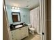 Bathroom with a shower/tub combo, single sink vanity with black countertop, and neutral tones at 3506 54Th W Dr # 103, Bradenton, FL 34210