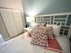 Bright and airy bedroom with a bed featuring stylish flamingo pillows and a cozy throw blanket at 3506 54Th W Dr # 103, Bradenton, FL 34210