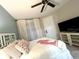 Bedroom featuring a bed with a decorative headboard and a TV in the corner of the room at 3506 54Th W Dr # 103, Bradenton, FL 34210