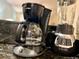 Granite counters feature a black Mr. Coffee coffee maker and Black and Decker blender at 3506 54Th W Dr # 103, Bradenton, FL 34210
