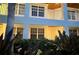 Inviting exterior view featuring a balcony and lush greenery surrounding the building at 3506 54Th W Dr # 103, Bradenton, FL 34210