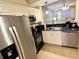 Efficient kitchen layout features stainless steel appliances and classic white cabinetry at 3506 54Th W Dr # 103, Bradenton, FL 34210