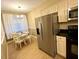 Eat-in kitchen with stainless steel appliances, black counters, and ample natural light at 3506 54Th W Dr # 103, Bradenton, FL 34210