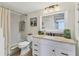 Bright bathroom featuring white vanity, granite counters, and a shower/tub combo at 3690 Pinecrest St # 114, Sarasota, FL 34232