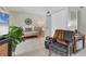 Bedroom area showcasing a rattan daybed, accent chair, side table, and modern decor at 3690 Pinecrest St # 114, Sarasota, FL 34232