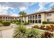 Beautifully landscaped courtyard with fountain, tropical plants and flowering shrubs at 3690 Pinecrest St # 114, Sarasota, FL 34232