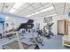 Community fitness center featuring modern exercise equipment, mirrors, and motivational wall decor in a brightly lit space at 3690 Pinecrest St # 114, Sarasota, FL 34232