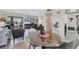 Bright living room featuring tile floors, glass table and sliding glass doors leading to outdoor patio at 3690 Pinecrest St # 114, Sarasota, FL 34232