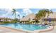 Beautiful community pool area with ample seating and lush landscaping, perfect for relaxation and recreation at 3690 Pinecrest St # 114, Sarasota, FL 34232