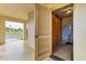 Ground floor storage area with access to building corridor and exterior with view of community at 3690 Pinecrest St # 114, Sarasota, FL 34232