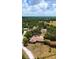 Aerial view of the home and property, showcasing mature trees and spacious surroundings at 3717 Downer Ave, Sarasota, FL 34240