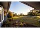 Scenic view of a large backyard with lush landscaping and a wooden fence, creating a tranquil outdoor space at 3717 Downer Ave, Sarasota, FL 34240