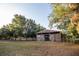 Large barn with wooden doors, surrounded by trees at 3717 Downer Ave, Sarasota, FL 34240