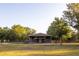 Spacious barn with ample room for livestock and equipment, set on a lush green pasture at 3717 Downer Ave, Sarasota, FL 34240
