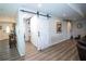 Finished basement area featuring barn doors, recessed lighting, and durable flooring at 3717 Downer Ave, Sarasota, FL 34240