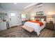 Cozy bedroom with comfortable furnishings, modern decor, and light-filled window at 3717 Downer Ave, Sarasota, FL 34240