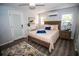 Cozy bedroom with a comfortable bed, stylish rug, and plenty of natural light at 3717 Downer Ave, Sarasota, FL 34240