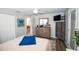 Bright bedroom with stylish wood-look dresser, mounted TV, and comfortable decor at 3717 Downer Ave, Sarasota, FL 34240