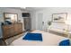 Comfortable bedroom featuring a wood-look dresser, mounted TV, and neutral walls at 3717 Downer Ave, Sarasota, FL 34240