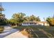 Charming single story home with mature trees and inviting front porch at 3717 Downer Ave, Sarasota, FL 34240