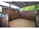 Inside horse stall with fan for ventilation and wood shavings on the floor at 3717 Downer Ave, Sarasota, FL 34240