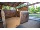 Safe horse stall with secure wood fence and metal gate at 3717 Downer Ave, Sarasota, FL 34240