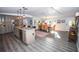 Spacious kitchen with an island, a stylish rug, and access to the dining area at 3717 Downer Ave, Sarasota, FL 34240