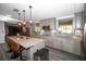 Kitchen with an island, granite counters, stainless steel appliances, and tile backsplash at 3717 Downer Ave, Sarasota, FL 34240