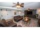 Cozy living room with two leather sofas, ceiling fans, and sliding barn doors at 3717 Downer Ave, Sarasota, FL 34240