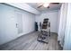 This spare room boasts wood-look floors, white walls, ceiling fan, and neutral finishes at 3717 Downer Ave, Sarasota, FL 34240