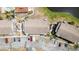 Overhead view of the building, showing parking, landscaping, nearby pool, and pond at 3781 59Th W Ave # 3781, Bradenton, FL 34210