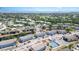This aerial view showcases community buildings, water features, golf course and the ocean at 3781 59Th W Ave # 3781, Bradenton, FL 34210