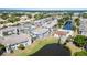 Aerial view features lush landscaping, several ponds, community pool and well-maintained buildings at 3781 59Th W Ave # 3781, Bradenton, FL 34210