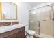Bathroom featuring a sliding glass door shower, updated vanity, and contemporary fixtures at 3781 59Th W Ave # 3781, Bradenton, FL 34210