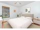 Stylishly staged bedroom features neutral decor and ample natural light at 3781 59Th W Ave # 3781, Bradenton, FL 34210