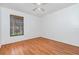 Bright bedroom featuring wood-look floors and a window with views of lush greenery at 3781 59Th W Ave # 3781, Bradenton, FL 34210