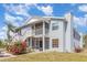 Light blue condo with screened porch, balcony, flowering bushes, and painted stairs at 3781 59Th W Ave # 3781, Bradenton, FL 34210