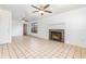Living room with fireplace, ceiling fans, tile flooring and neutral paint at 3781 59Th W Ave # 3781, Bradenton, FL 34210