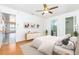 Serene main bedroom with a ceiling fan, walk-in closet, and an ensuite bathroom with natural light at 3781 59Th W Ave # 3781, Bradenton, FL 34210