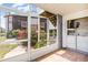 Enclosed outdoor patio with laundry area overlooking the garden at 3781 59Th W Ave # 3781, Bradenton, FL 34210