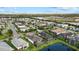 Aerial view showcasing a desirable residential community with lakes, manicured lawns, pools and lovely homes at 3808 Eastham Ln, Bradenton, FL 34211
