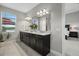 Modern bathroom featuring a double vanity, granite countertops, and views of the outdoor deck at 3808 Eastham Ln, Bradenton, FL 34211
