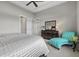 Spacious bedroom with walk-in closets, large window, and a stylish accent chair at 3808 Eastham Ln, Bradenton, FL 34211
