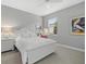 Cozy bedroom with white furniture, soft carpet, and natural light from the window at 3808 Eastham Ln, Bradenton, FL 34211