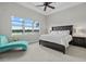 Bright Primary bedroom with scenic lake view and a stylish chaise lounge at 3808 Eastham Ln, Bradenton, FL 34211