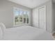 Bedroom featuring plantation shutters, a closet, and modern decor at 3808 Eastham Ln, Bradenton, FL 34211