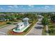 Welcoming community entrance with a charming water feature, lush landscaping, and a grand gatehouse at 3808 Eastham Ln, Bradenton, FL 34211